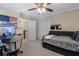 This bedroom features a ceiling fan, desk, and closet at 105 Woodmeade Nw Way, Marietta, GA 30064