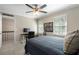 This bedroom features natural light and a ceiling fan at 105 Woodmeade Nw Way, Marietta, GA 30064