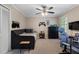This bedroom features a ceiling fan, desk, and a large bed at 105 Woodmeade Nw Way, Marietta, GA 30064