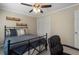 This bedroom features a ceiling fan and closet at 105 Woodmeade Nw Way, Marietta, GA 30064