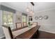 Elegant dining room featuring wood floors, a large dining table, and decorative accents at 105 Woodmeade Nw Way, Marietta, GA 30064