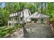 Beautiful two-story home with a charming porch and a convenient adjacent carport at 105 Woodmeade Nw Way, Marietta, GA 30064
