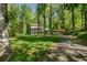 Beautiful two-story home with a lush, tree-filled yard, long driveway, and convenient carport at 105 Woodmeade Nw Way, Marietta, GA 30064