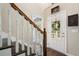 Welcoming foyer features hardwood floors, a staircase, and a front door with decorative glass at 105 Woodmeade Nw Way, Marietta, GA 30064