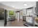 Well-lit kitchen with modern appliances, granite countertops, and a cozy breakfast bar at 105 Woodmeade Nw Way, Marietta, GA 30064