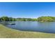 Scenic lake view featuring a private dock and lush green surroundings at 105 Woodmeade Nw Way, Marietta, GA 30064