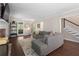 Inviting living room features a brick fireplace, hardwood floors, and plenty of natural light at 105 Woodmeade Nw Way, Marietta, GA 30064