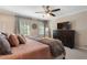 Spacious main bedroom featuring two windows, soft colors, and carpeted floors at 105 Woodmeade Nw Way, Marietta, GA 30064