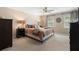 Large main bedroom with plush carpet, a ceiling fan, and lots of natural light at 105 Woodmeade Nw Way, Marietta, GA 30064