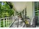 Inviting covered porch with comfortable seating and serene views of the surrounding trees at 105 Woodmeade Nw Way, Marietta, GA 30064