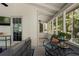 Relaxing screened-in porch with comfortable seating and views of the lush, wooded surroundings at 105 Woodmeade Nw Way, Marietta, GA 30064