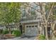 Charming townhome showcasing a well-maintained exterior, front yard, and private garage at 1971 Sterling Oaks Cir, Brookhaven, GA 30319