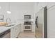 Modern kitchen featuring stainless steel appliances, sleek countertops, and white cabinetry at 1971 Sterling Oaks Cir, Brookhaven, GA 30319