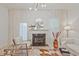 Relaxing living room with fireplace and abundant natural light creating a serene atmosphere at 1971 Sterling Oaks Cir, Brookhaven, GA 30319