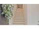 Bright foyer showcasing new staircase with a decorative wreath on front door at 1971 Sterling Oaks Cir, Brookhaven, GA 30319