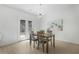 Modern dining room with stylish light fixture and view to outside at 4740 Alford Commons, Cumming, GA 30028