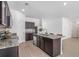 Well-equipped kitchen with granite countertops, stainless steel appliances, and center island at 4740 Alford Commons, Cumming, GA 30028