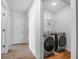 Convenient laundry room with modern front-load washer and dryer units at 4740 Alford Commons, Cumming, GA 30028