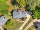 Stunning aerial view of home with lush green lawn, mature trees, and circular driveway at 744 Edgewater Nw Ln, Kennesaw, GA 30144
