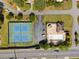 Aerial shot of neighborhood tennis courts, community pool, and clubhouse at 744 Edgewater Nw Ln, Kennesaw, GA 30144