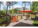 Back deck with an outdoor dining area and views of a private back yard at 744 Edgewater Nw Ln, Kennesaw, GA 30144