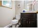 Small bathroom features a granite countertop vanity and neutral wall paint at 744 Edgewater Nw Ln, Kennesaw, GA 30144