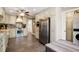 Eat-in kitchen boasts stainless appliances, bright cabinets, and plenty of storage at 744 Edgewater Nw Ln, Kennesaw, GA 30144