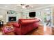 Comfortable living room with fireplace, hardwood floors, and stylish furniture at 744 Edgewater Nw Ln, Kennesaw, GA 30144