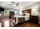 This main bedroom features a ceiling fan, hardwood floors and windows allowing for plenty of natural light at 744 Edgewater Nw Ln, Kennesaw, GA 30144