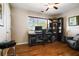 Home office offers wood flooring and lots of natural light from the bright window at 744 Edgewater Nw Ln, Kennesaw, GA 30144