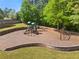 Charming playground nestled in a green space, with slides and swings for Gathering fun and outdoor activities at 744 Edgewater Nw Ln, Kennesaw, GA 30144