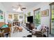 Bright sunroom with checkerboard floor and cozy seating area at 744 Edgewater Nw Ln, Kennesaw, GA 30144