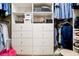 This walk-in closet is equipped with custom shelving and storage at 744 Edgewater Nw Ln, Kennesaw, GA 30144