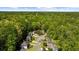 A high angle aerial view of the neighborhood and surrounding trees at 815 Connell Ln, Lawrenceville, GA 30044