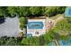 A high-angle shot showcasing a community pool with lounge chairs and a parking lot at 815 Connell Ln, Lawrenceville, GA 30044