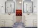 Bathroom featuring double sinks and vanities with mosaic tile floor at 815 Connell Ln, Lawrenceville, GA 30044