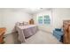 Neutral bedroom with soft lighting and a large window at 815 Connell Ln, Lawrenceville, GA 30044