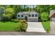 Charming two-story home with a well-manicured lawn, beautiful landscaping, and a two-car garage at 815 Connell Ln, Lawrenceville, GA 30044
