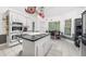 Bright kitchen with granite counters, wine rack, stainless steel appliances, and a center island at 815 Connell Ln, Lawrenceville, GA 30044