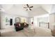 Bright and open living room leads to a kitchen, dining room, and staircase at 815 Connell Ln, Lawrenceville, GA 30044