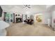 Open living room with high ceilings, ceiling fan, fireplace, and windows at 815 Connell Ln, Lawrenceville, GA 30044