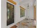 Inviting front porch featuring stone flooring, a stylish light fixture, and a charming welcome mat at 329 Mont Harmony Sw Rd, Powder Springs, GA 30127