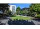 Inviting outdoor area with lush lawn and a charming pergola, perfect for relaxing and enjoying the outdoors at 1268 Appleden Way # 17, Brookhaven, GA 30319