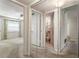 View of a bedroom with carpet, a ceiling fan, window with blinds and a bathroom with a peach-colored toilet at 4282 Roswell Ne Rd # C3, Atlanta, GA 30342