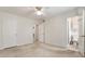 Spacious bedroom featuring neutral carpet, white walls, and an en-suite bathroom for added convenience at 4282 Roswell Ne Rd # C3, Atlanta, GA 30342