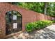 Brick wall and iron gate to a dog park for residents only at 4282 Roswell Ne Rd # C3, Atlanta, GA 30342