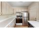 Efficient kitchen with gas range, stainless refrigerator, and lots of cabinets for your convenience at 4282 Roswell Ne Rd # C3, Atlanta, GA 30342