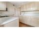 Functional kitchen with wood-look floors, pantry, and ample cabinets for all your storage needs at 4282 Roswell Ne Rd # C3, Atlanta, GA 30342