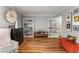 Spacious living room with hardwood floors and stylish shelving for books and décor at 6900 Roswell Rd # Q26, Atlanta, GA 30328