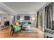 Cozy living room with stylish furniture, wood floors, and ample natural light from the sliding glass doors at 6900 Roswell Rd # Q26, Atlanta, GA 30328